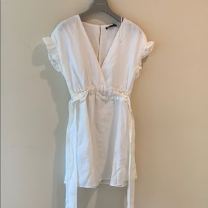 White dress + complementary earrings.